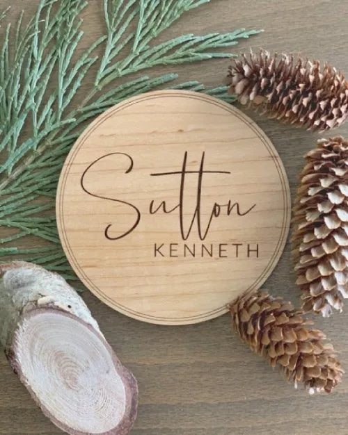 Baby name sign, welcoming home baby name sign, minimalistic birth announcement, next to pine tree decor.