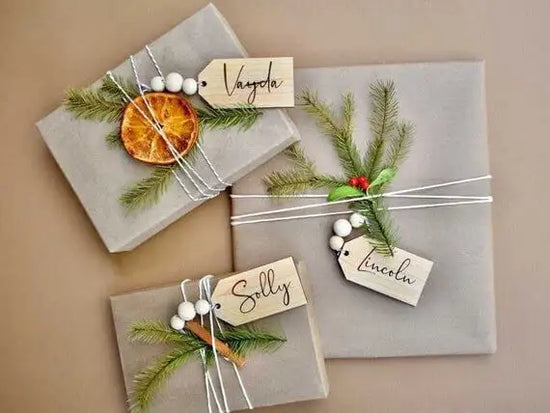 3.5" personalized wooden tags with wooden beads on 3 gray wrapped Christmas gifts