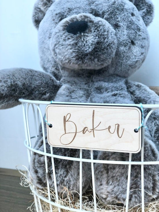 Custom wooden gift tags, custom name tags for Easter baskets on a white Easter basket with a bear.