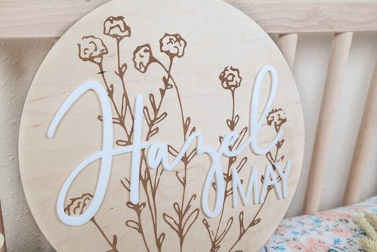 Load image into Gallery viewer, baby girl nursery name sign with botanical details inside wooden crib
