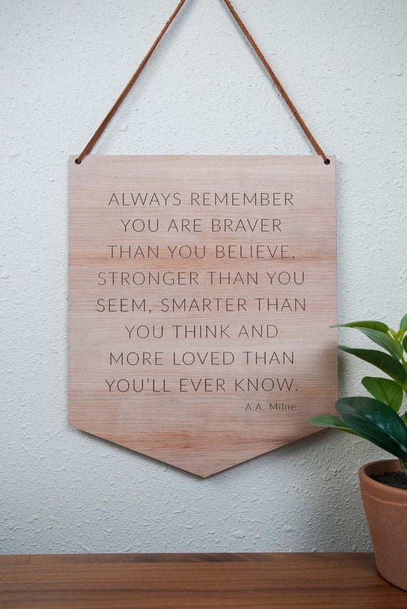 Load image into Gallery viewer, wooden nursery quote hanging on a white wall with green plants
