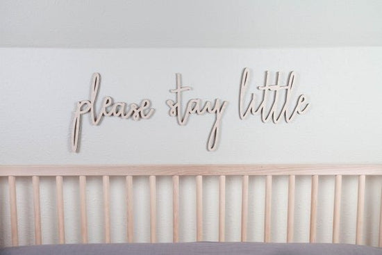Load image into Gallery viewer, please stay little above the crib cut out sign on a white wall next to a wooden crib
