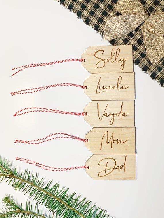 3.5" personalized wooden tags with red string next plant and golden bow