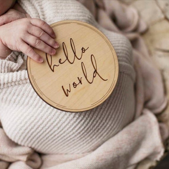 Load image into Gallery viewer, Baby milestone circle Hello world, baby milestone circles, milestone disks. Newborn baby holding Hello world circle.
