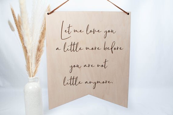 Let me Love you nursery sign hanging on white background
