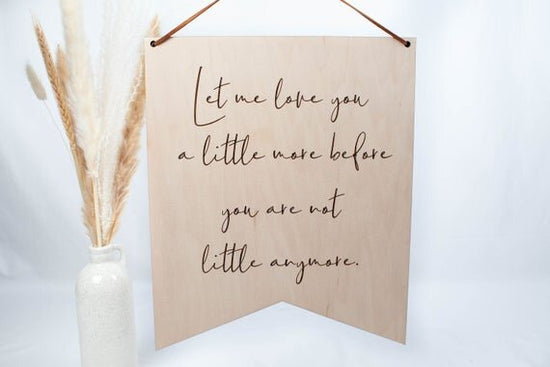 Let me Love you nursery sign hanging on white background